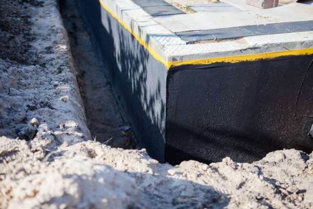Professional Emergency Waterproofing technician working in Woodmere, NY